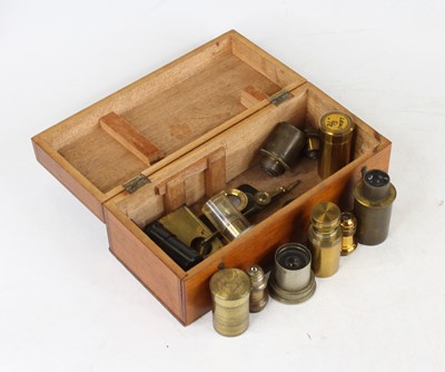 Lot 6 - A 19th century lacquered brass microscope lens...