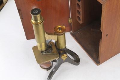 Lot 12 - A 19th century lacquered brass monocular...