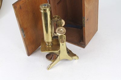 Lot 15 - A late 19th century lacquered brass monocular...