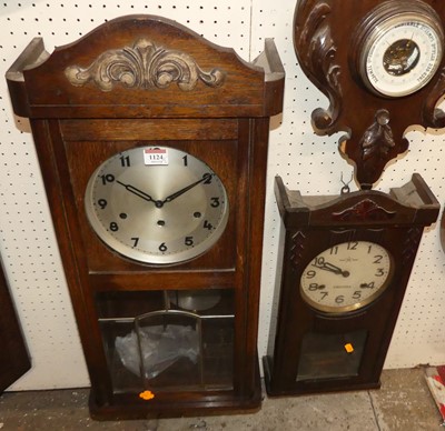 Lot 1124 - Two 1930s oak drop trunk wall clocks