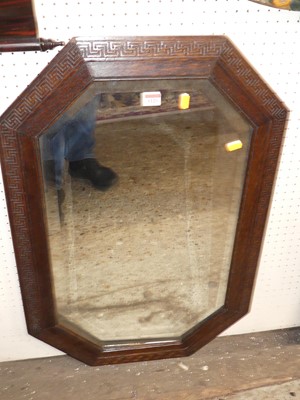 Lot 1129 - A 1920s oak octagonal bevelled wall mirror, 82...