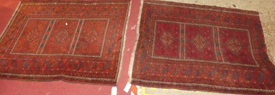 Lot 1145 - A Persian woollen red ground bokhara rug, 137...