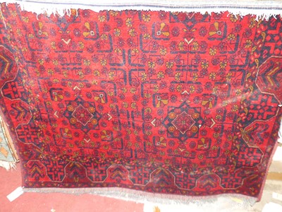 Lot 1151 - A Persian woollen red ground bokhara rug, 195...