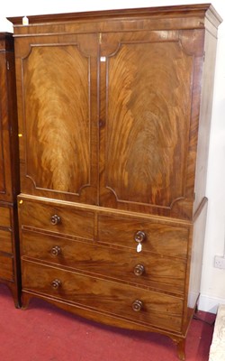 Lot 1159 - A Regency mahogany linen press, the twin door...