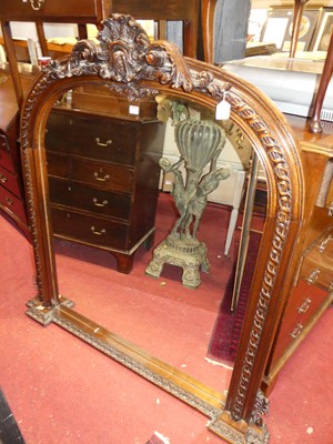 Lot 1170 - A Victorian style heavily floral carved oak...