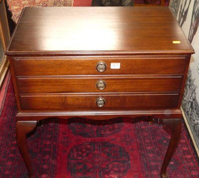 Lot 1173 - A contemporary mahogany low three-drawer...