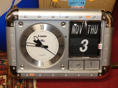 Lot 1174 - A contemporary metal wall clock with calendar,...