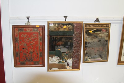 Lot 630 - A Chinese wall mirror, the rectangular plate...