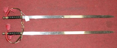 Lot 632 - A pair of ornamental swords each having blunt...