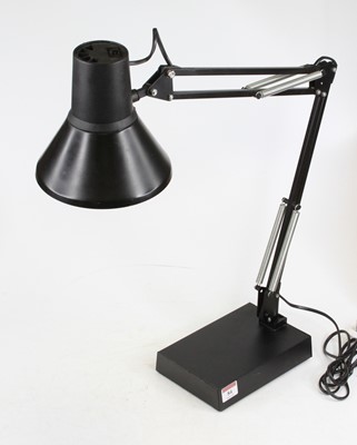 Lot 84 - A black painted anglepoise style desk lamp, on...