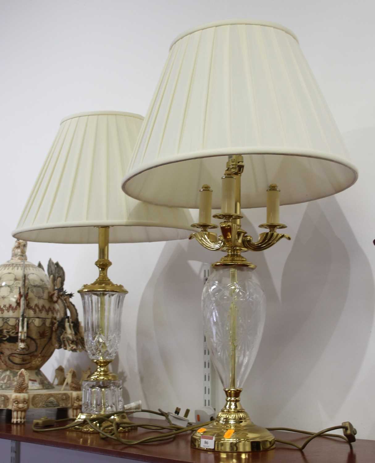 Lot 86 - A brass mounted cut glass table lamp of ovoid...