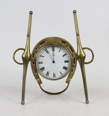 Lot 119 - An early 20th century brass cased strut clock...