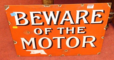 Lot 1239 - An enamel on metal wall sign titled Beware of...