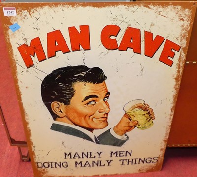 Lot 1242 - A printed tin wall sign titled Man Cave, 70 x...