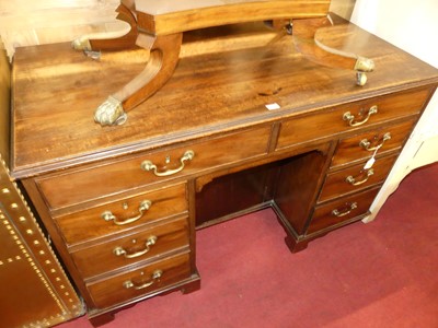 Lot 1253 - An early 19th century mahogany kneehole desk,...