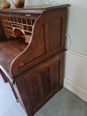 Lot 1257 - A 1930s oak rolltop desk, one pedestal fitted...