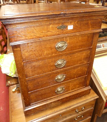 Lot 1266 - A circa 1900 oak chest of four long drawers,...