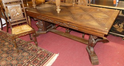 Lot 1280 - A Belgian oak drawleaf refectory dining table,...