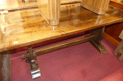 Lot 1295 - A rustic plank topped joined oak trestle end...