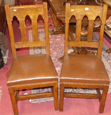 Lot 1297 - A set of six Arts & Crafts style oak lancet...