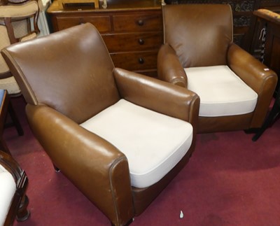 Lot 1316 - A pair of contemporary tan leather club chairs,...