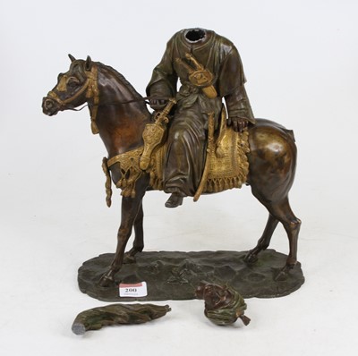 Lot 200 - A parcel gilt bronzed figure of an Arab on...