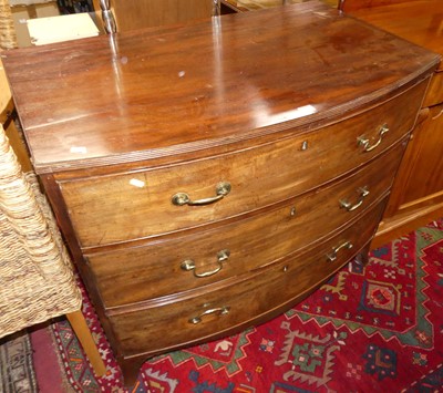 Lot 1395 - A Regency mahogany bowfront chest of three...