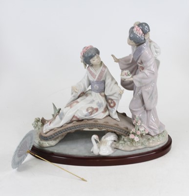 Lot 212 - A Lladro porcelain figure of two geishas...