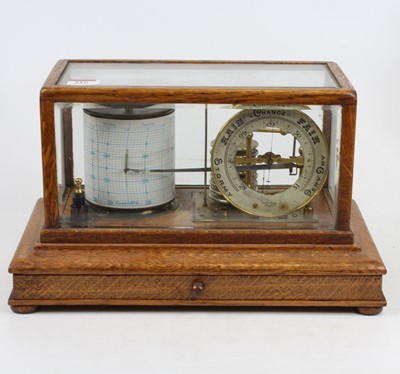 Lot 216 - An early 20th century barograph in glazed oak...