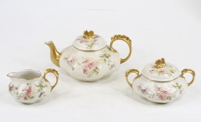 Lot 218 - A French porcelain floral painted parcel gilt...