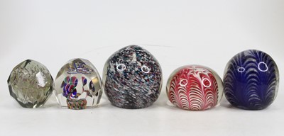 Lot 241 - A faceted glass paperweight interior decorated...