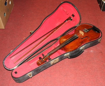 Lot 258 - A cased violin having a two piece maple back...