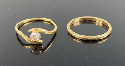 Lot 372 - An 18ct gold diamond solitaire ring, the bezel...