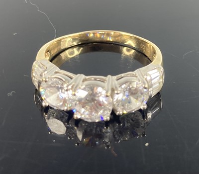 Lot 375 - A contemporary 14ct yellow gold and CZ  set...