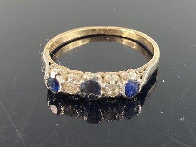 Lot 378 - A yellow metal sapphire and diamond five stone...