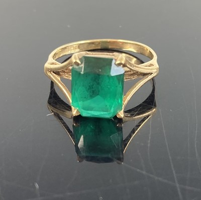 Lot 385 - A 9ct gold and green garnet set dress ring,...