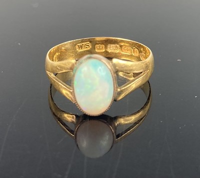 Lot 387 - A 22ct gold and cabochon opal set ring...