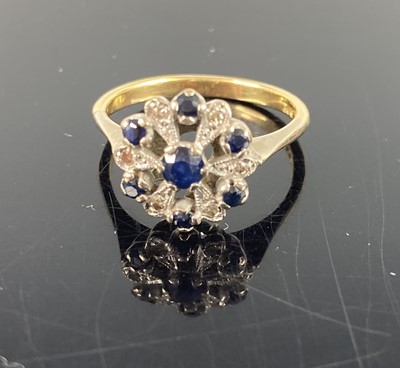 Lot 392 - An 18ct gold blue sapphire and diamond point...