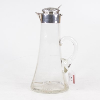 Lot 312 - An Edwardian claret jug, having a clear...