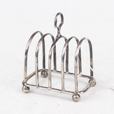 Lot 313 - A George V silver toast rack, having four...