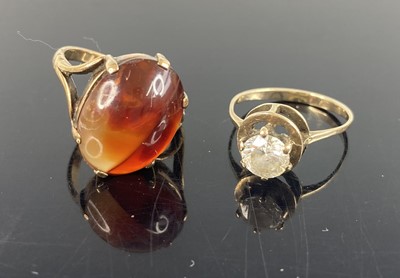 Lot 394 - A yellow metal and CZ set dress ring, unmarked...