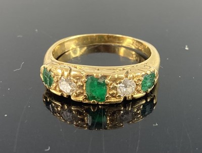 Lot 397 - An 18ct gold emerald and diamond half hoop...