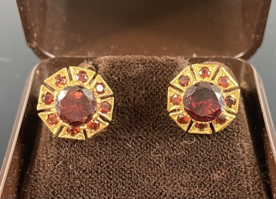 Lot 399 - A pair of 9ct gold garnet set ear clips with...