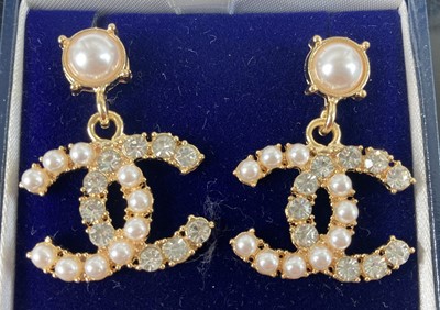 Lot 428 - After Coco Chanel pair of gilt metal and paste...