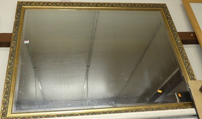 Lot 1015 - A gilt framed and bevelled rectangular wall...