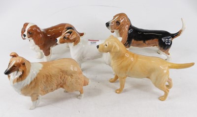 Lot 600 - A collection of five Beswick models of dogs,...