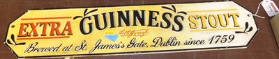 Lot 1044 - A reproduction cast iron sign for Guinness,...