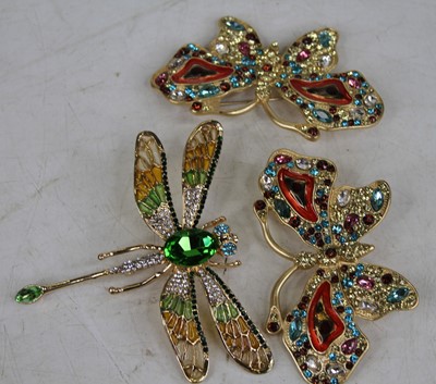 Lot 454 - Three modern paste set insect brooches