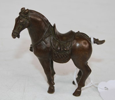 Lot 457 - A Chinese miniature bronzed model of a horse,...