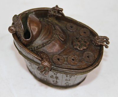 Lot 467 - A Chinese bronzed model of a bathing toad,...